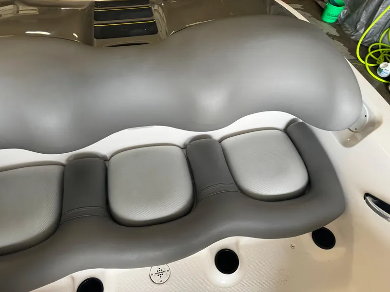 Slide: The Image of 1998 Yamaha Exciter boat interior with gray cushioned seating. - 12