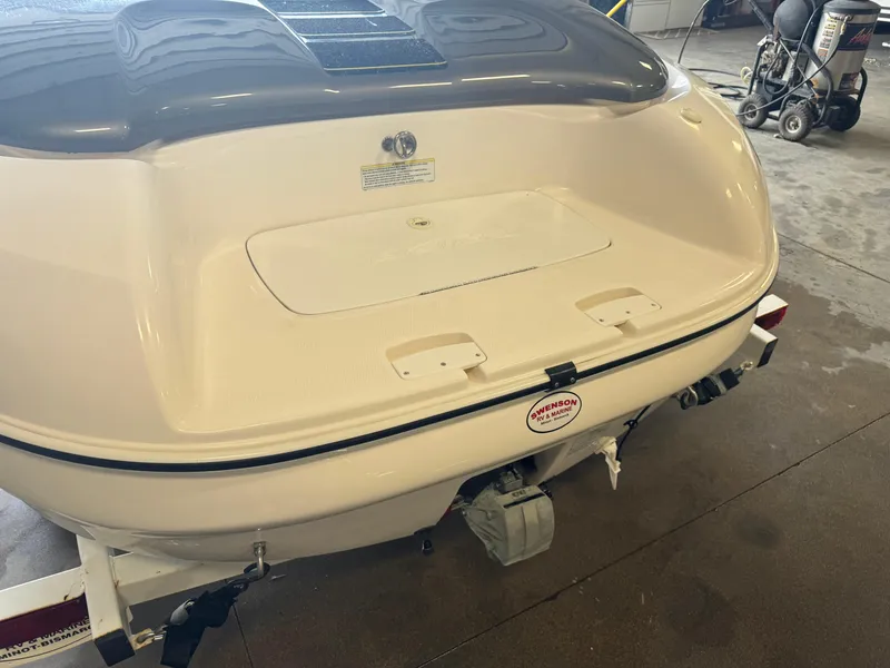 Slide: The Image of 1998 Yamaha Boats Exciter rear view in a garage setting. - 13