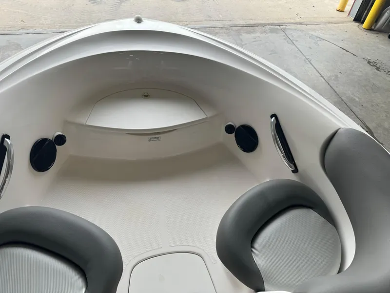 Slide: The Image of 1998 Yamaha Boats Exciter interior with gray seating and storage compartments. - 7