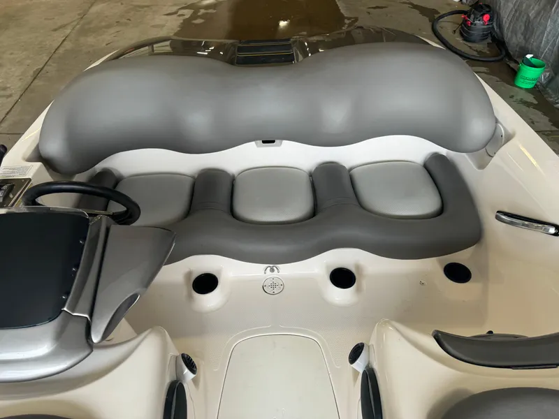 Slide: The Image of 1998 Yamaha Exciter boat interior with gray seating and steering wheel. - 8