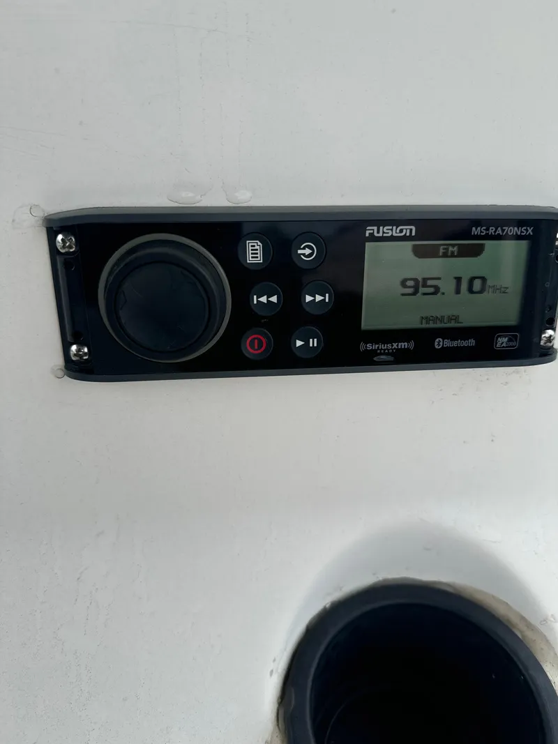 Slide: The Image of Fusion marine stereo on 2005 Sea Hunt Triton 232 boat dashboard. - 18