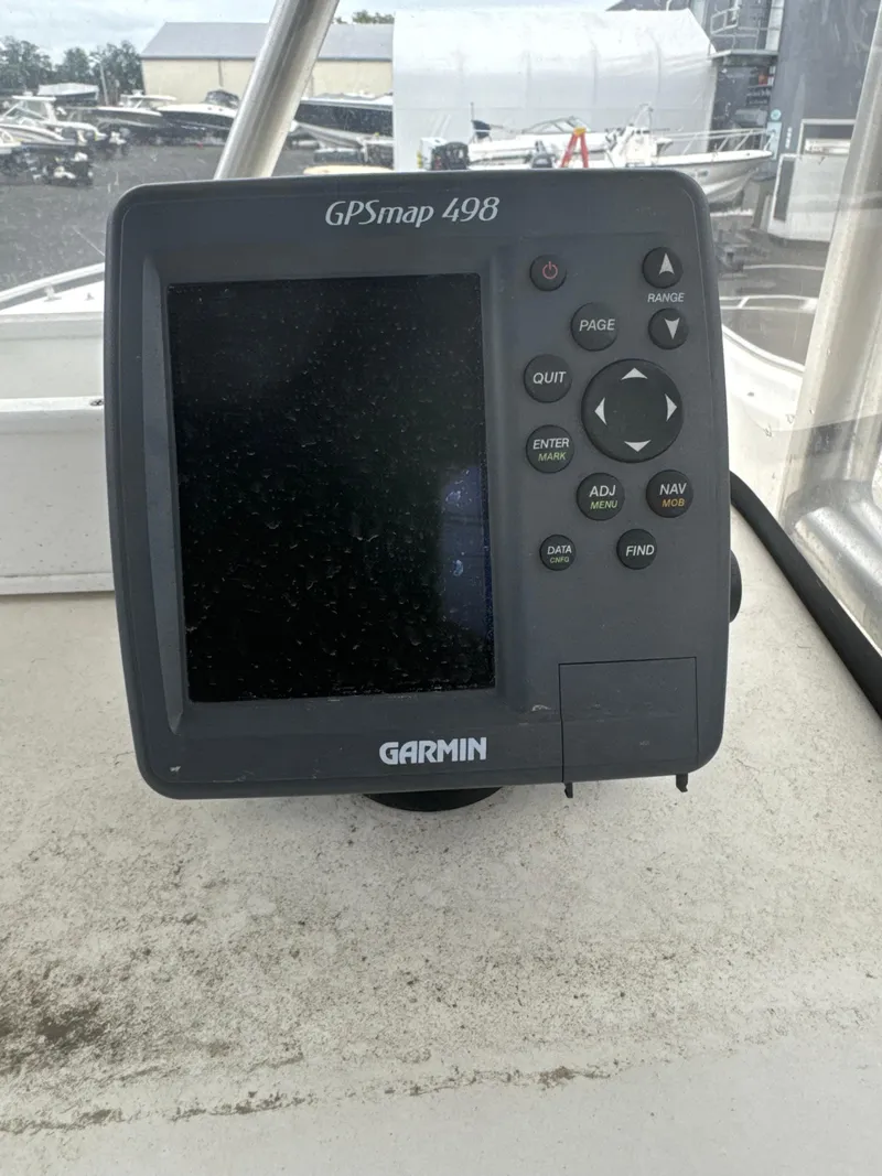 Slide: The Image of Garmin GPSmap 498 on 2005 Sea Hunt Triton 232 boat dashboard. - 21