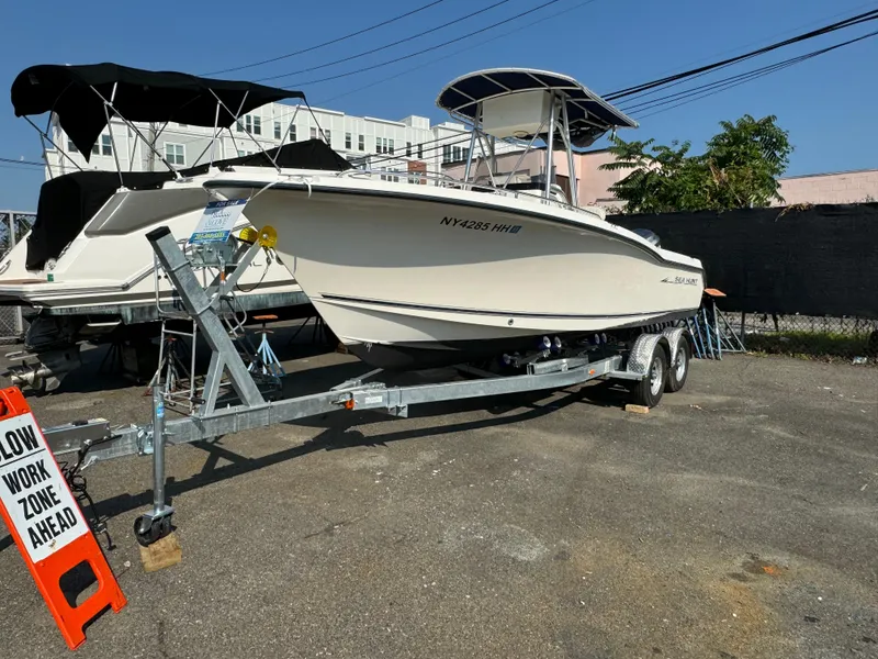 Slide: The Image of 2005 Sea Hunt Triton 232 boat on trailer in work zone. - 6