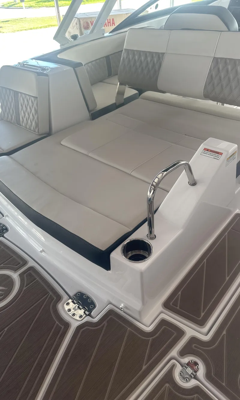 Slide: The Image of 2025 Monterey M45 boat interior with cushioned seating and modern design. - 12