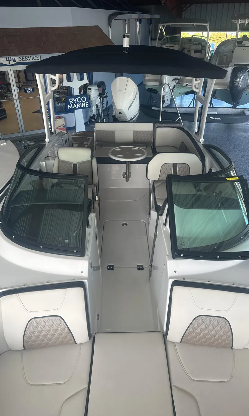 Slide: The Image of 2025 Monterey M45 boat interior with seating and steering, displayed at Ryco Marine showroom. - 13