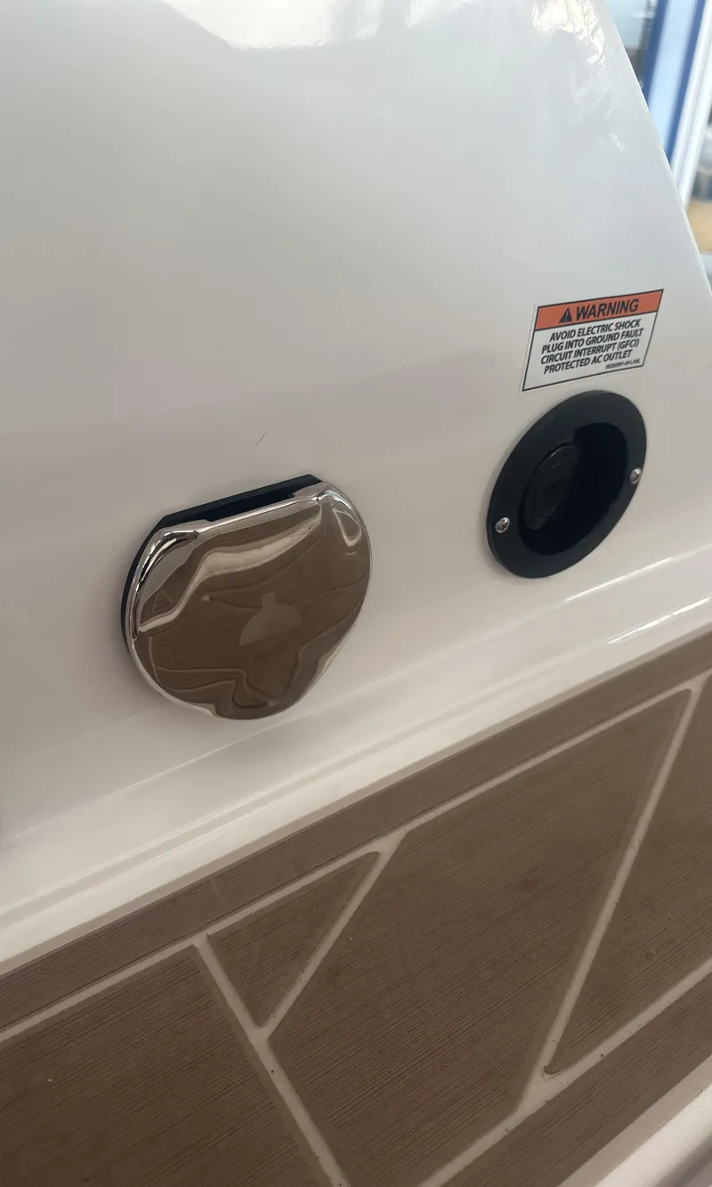 Slide: The Image of 2025 Monterey M45 boat detail showing fuel cap and warning label. - 15