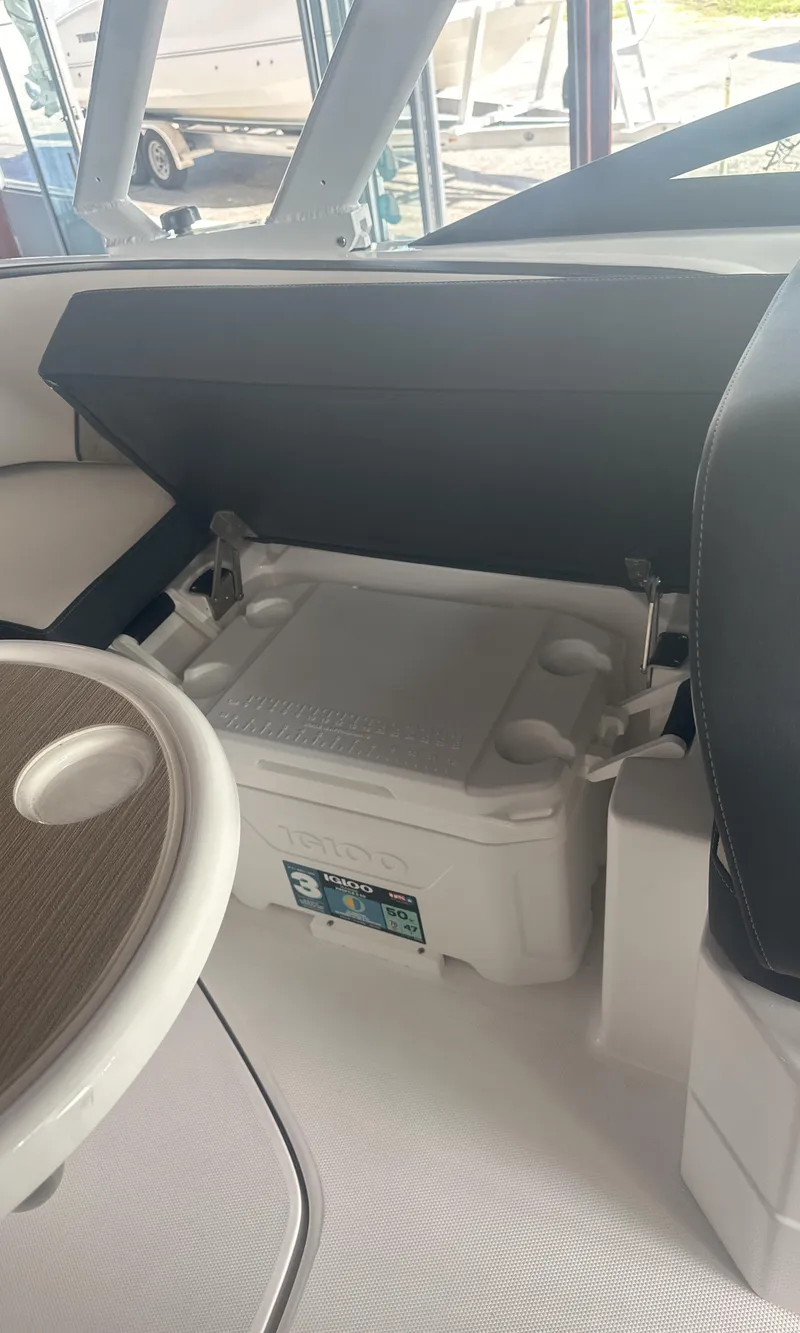 Slide: The Image of 2025 Monterey M45 boat interior with cooler and seating area. - 20