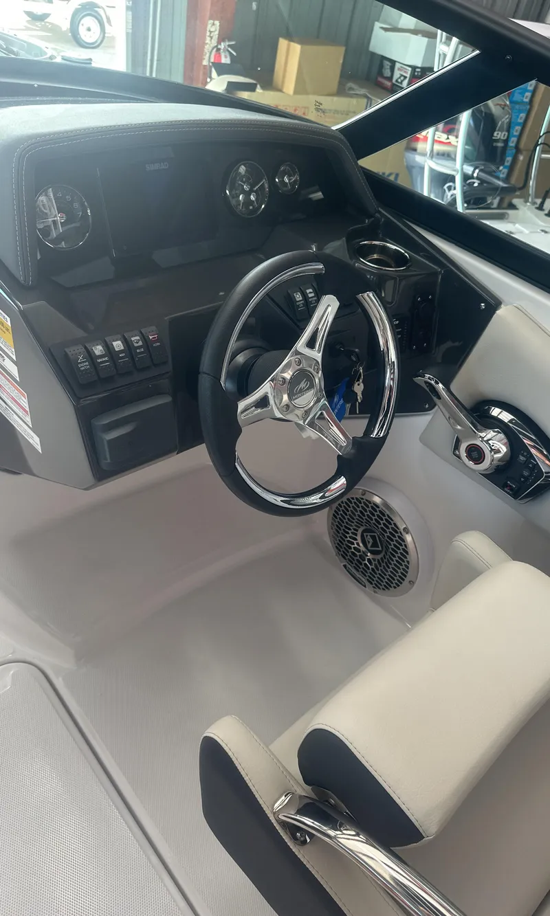 Slide: The Image of 2025 Monterey M45 boat interior with steering wheel and dashboard controls. - 21