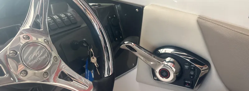 Slide: The Image of Steering wheel and controls of 2025 Monterey M45 boat interior. - 23