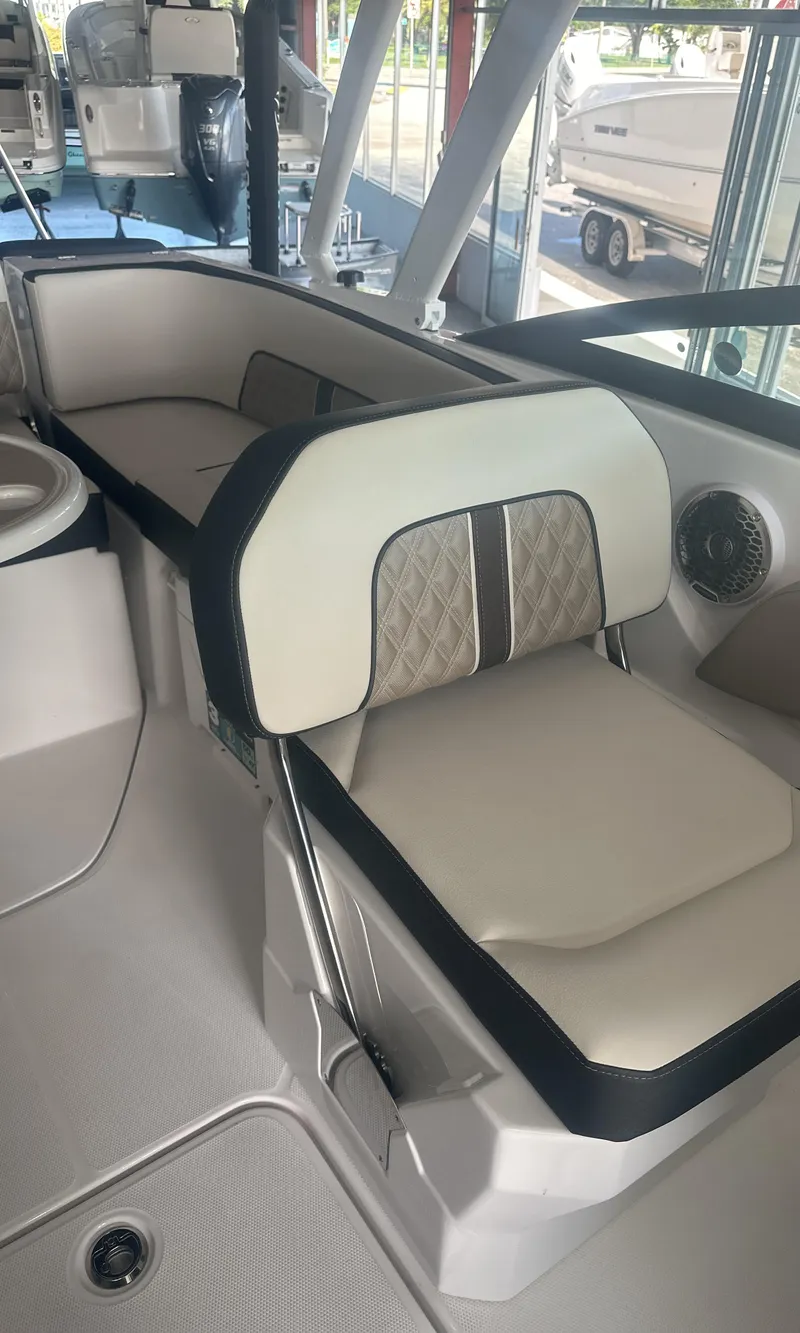 Slide: The Image of 2025 Monterey M45 boat interior with beige seating and modern design. - 24