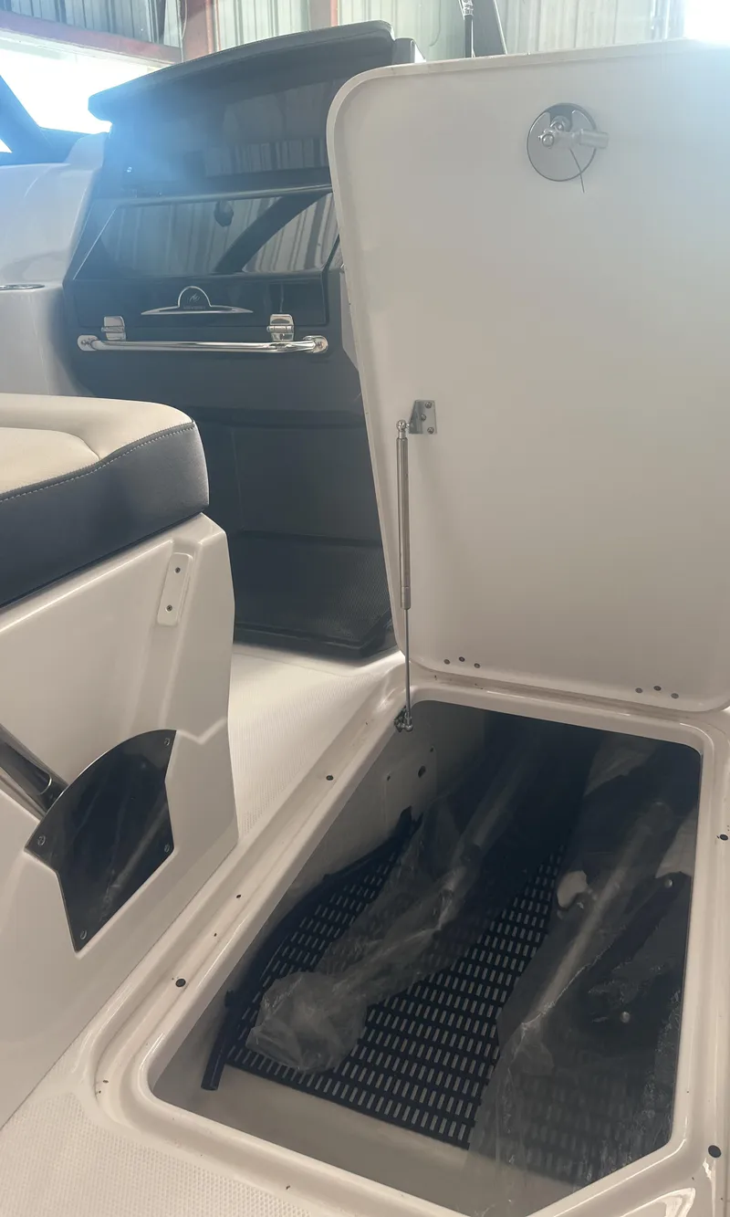 Slide: The Image of 2025 Monterey M45 boat interior storage compartment with open hatch. - 27