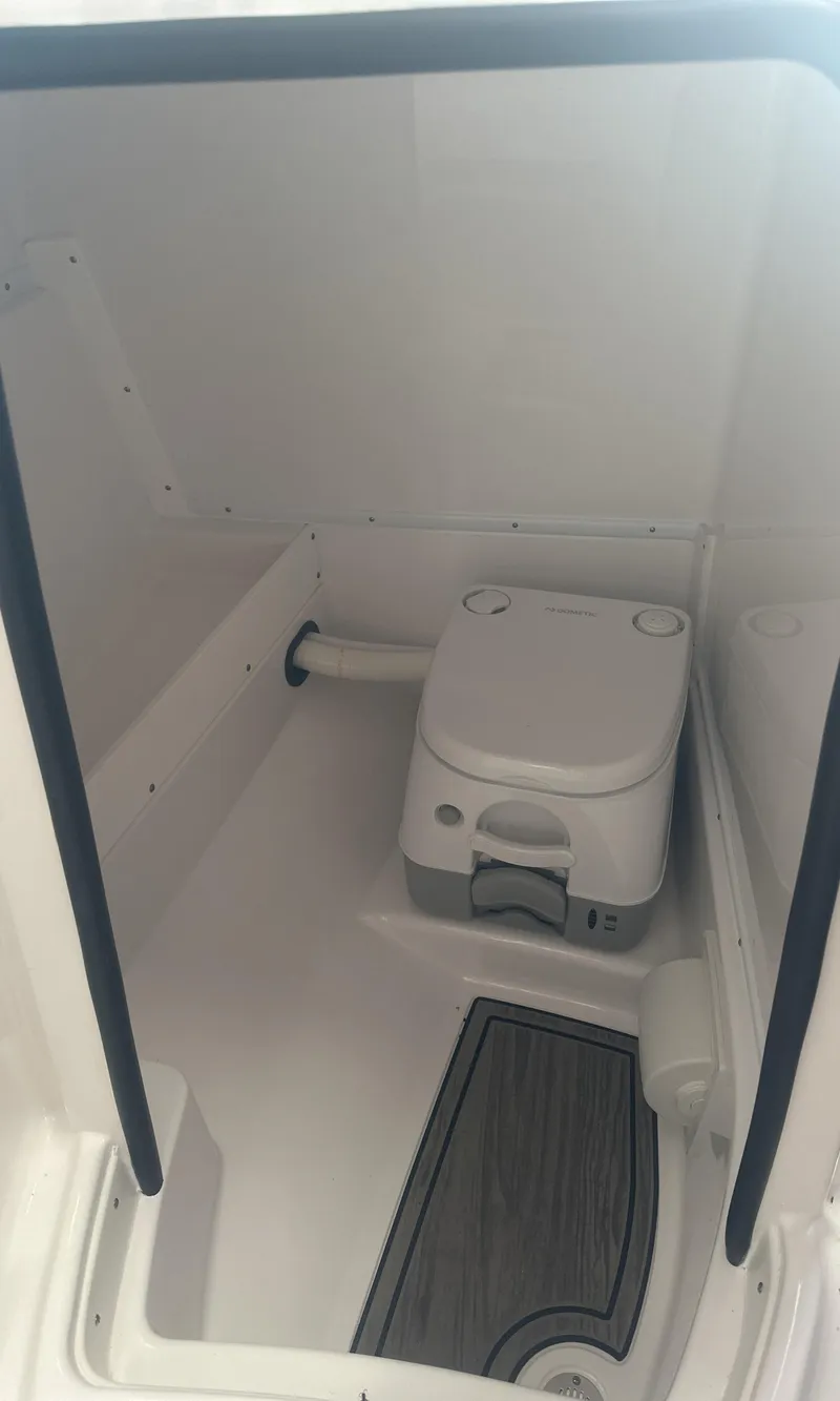 Slide: The Image of 2025 Monterey M45 boat interior with compact marine toilet. - 29