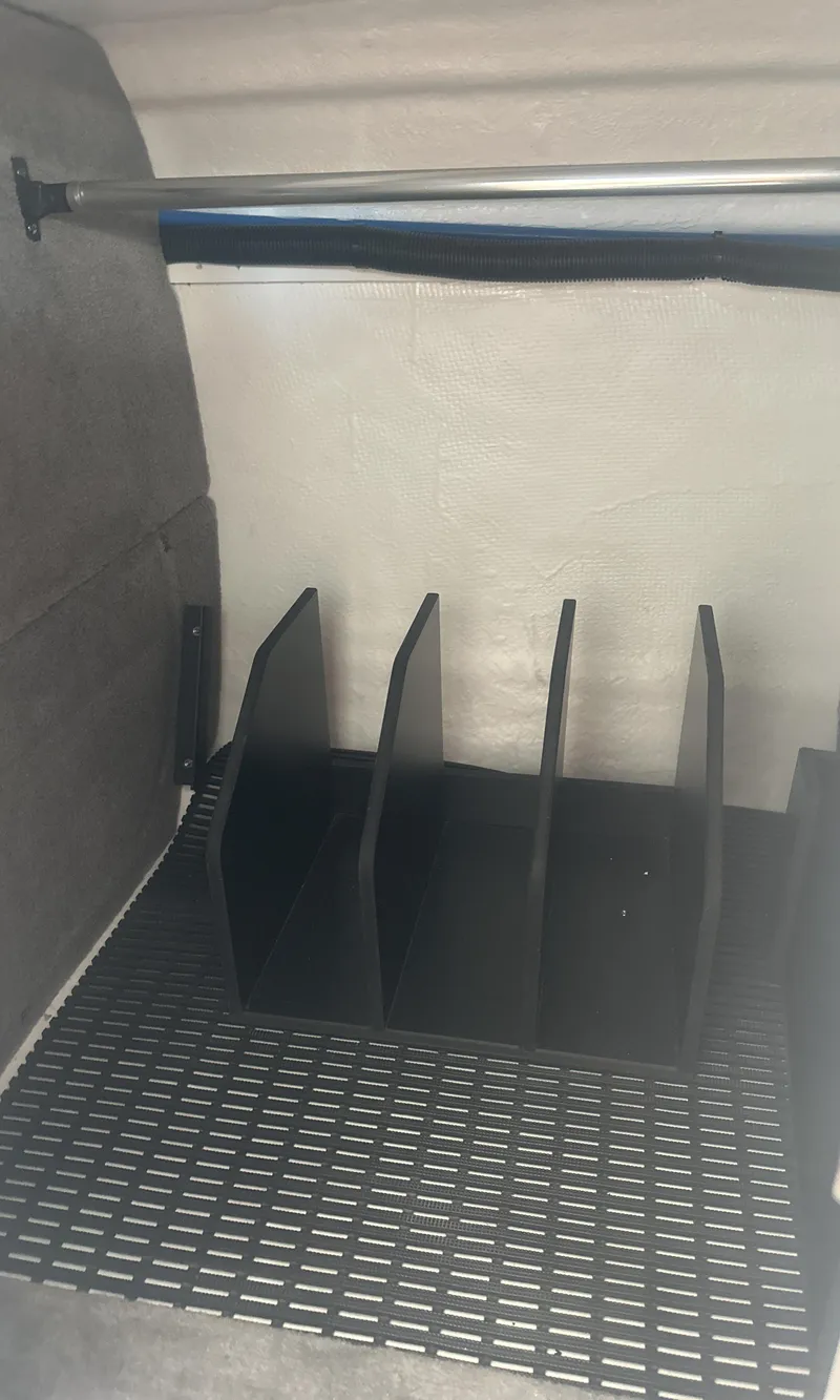 Slide: The Image of 2025 Monterey M45 interior storage compartment with dividers and non-slip mat. - 32