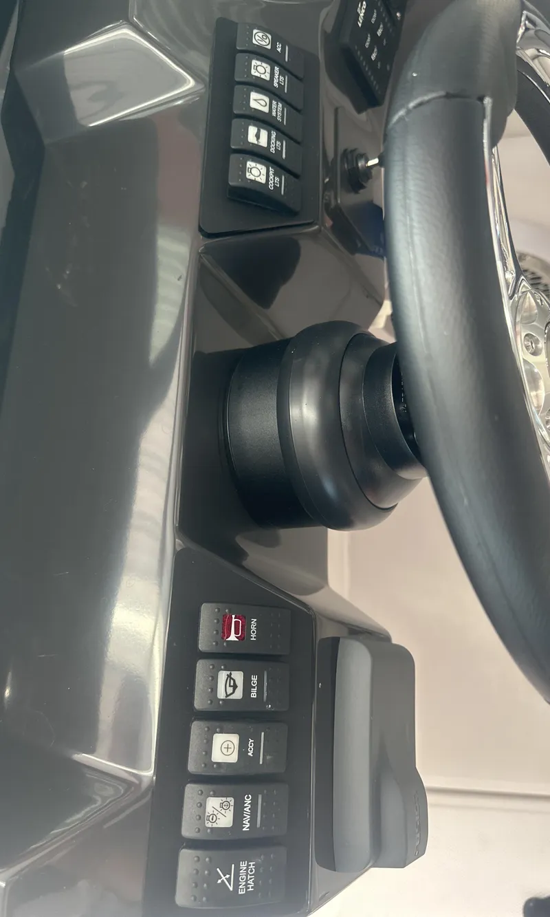 Slide: The Image of 2025 Monterey M45 dashboard with steering wheel and control buttons. - 38