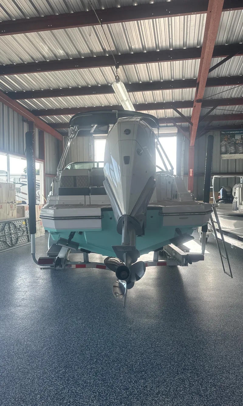 Slide: The Image of 2025 Monterey M45 boat in a showroom, rear view. - 4