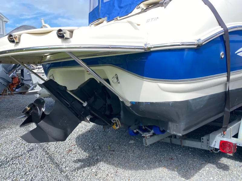 Slide: The Image of 2007 Stingray 22 DR boat on trailer, showing propeller and hull details. - 3