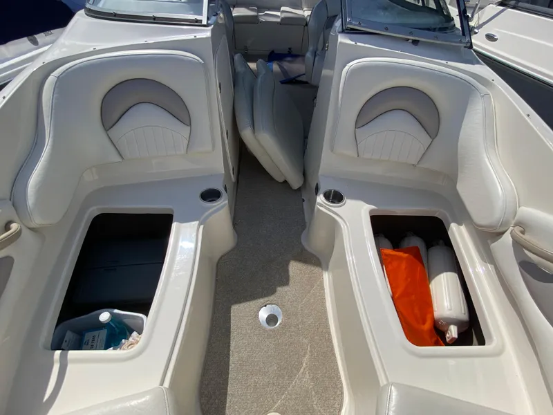 Slide: The Image of 2007 Stingray 22 DR boat interior with storage compartments and seating. - 9