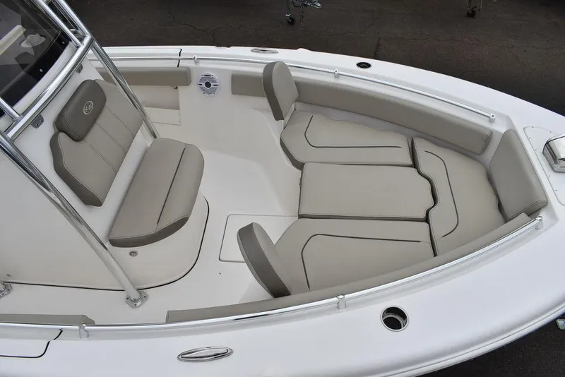 Slide: The Image of 2025 Key West 239 FS boat interior with cushioned seating and sleek design. - 14