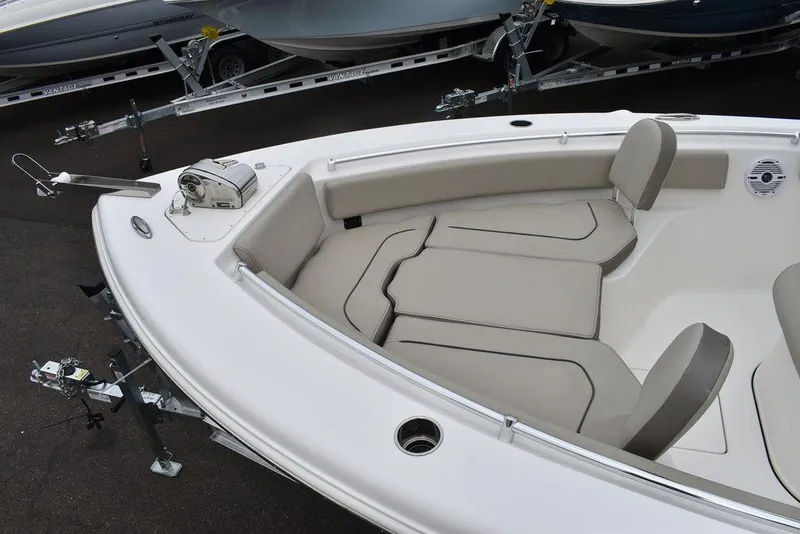 Slide: The Image of 2025 Key West 239 FS boat interior with cushioned seating and sleek design. - 17