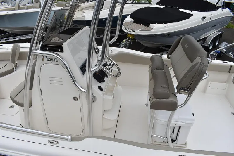Slide: The Image of 2025 Key West 239 FS boat interior with seating and console. - 22
