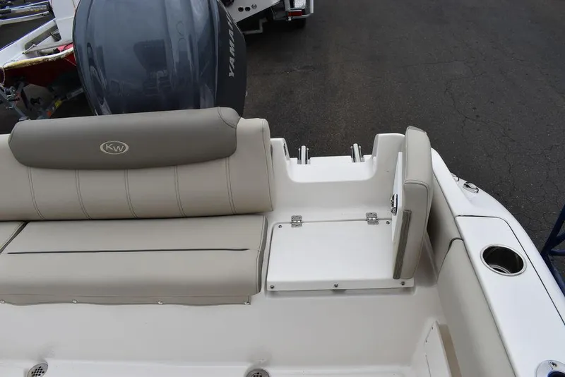 Slide: The Image of 2025 Key West 239 FS boat interior with seating and Yamaha engine. - 24
