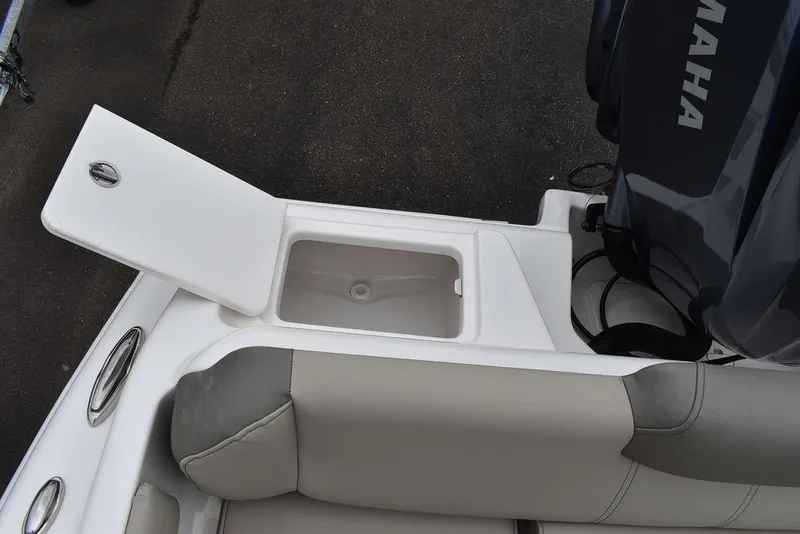 Slide: The Image of 2025 Key West 239 FS boat with open storage compartment and Yamaha engine. - 27