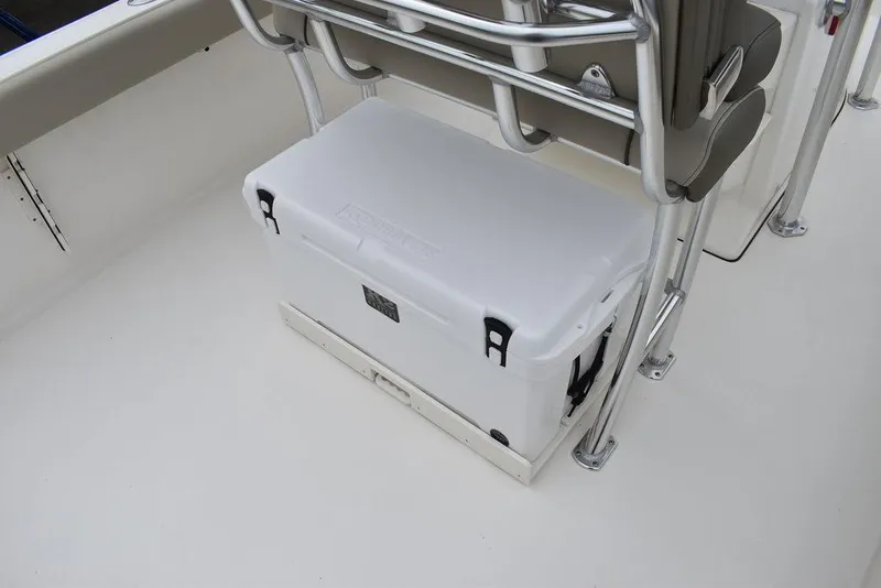 Slide: The Image of White cooler on 2025 Key West 239 FS boat deck, secured under seating. - 28