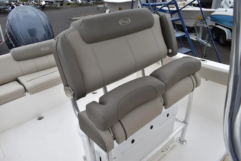 Slide: The Image of 2025 Key West 239 FS boat seating with gray upholstery and sleek design. - 31