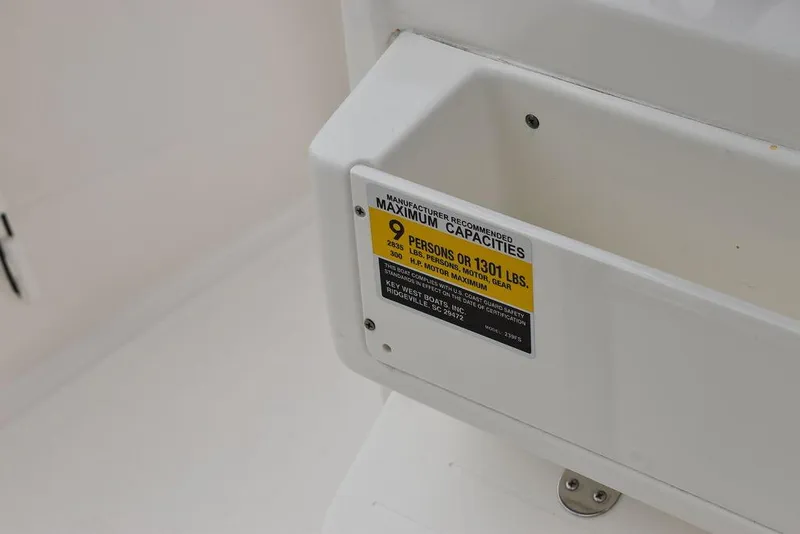 Slide: The Image of Key West 239 FS 2025 boat capacity label, 9 persons or 1301 lbs. - 38