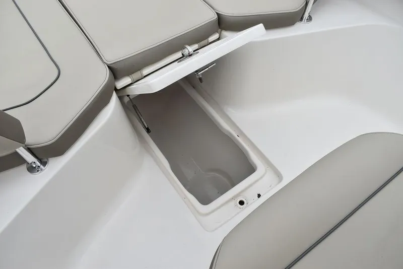 Slide: The Image of 2025 Key West 239 FS boat storage compartment with cushioned seating. - 42