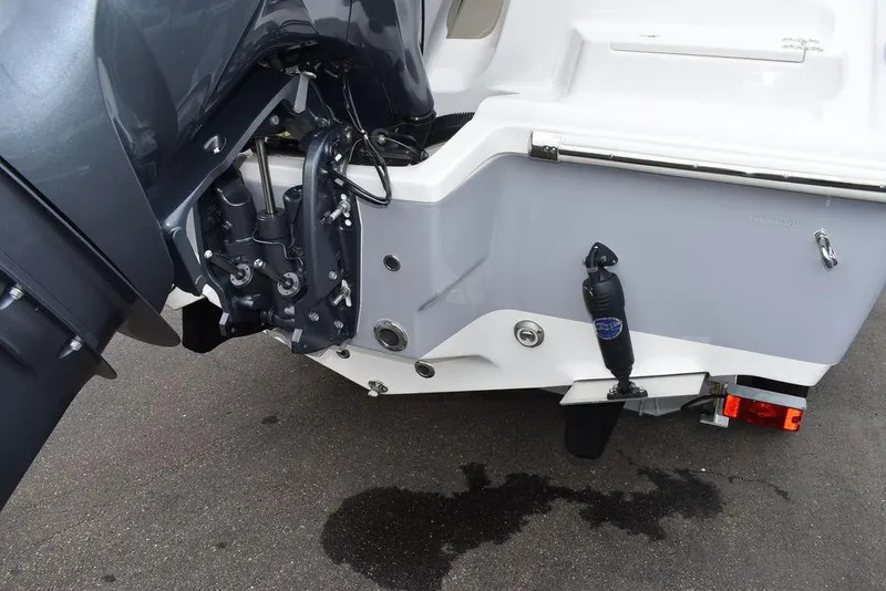 Slide: The Image of 2025 Key West 239 FS boat stern with outboard motor and trailer. - 47