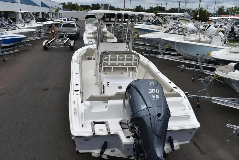 Slide: The Image of 2025 Key West 239 FS boat with Yamaha 300 V6 engine, displayed at a dealership. - 7