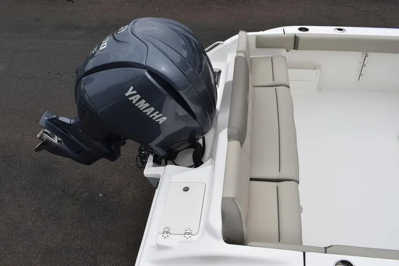 Slide: The Image of 2025 Key West 239 FS boat with Yamaha outboard motor and cushioned seating. - 8
