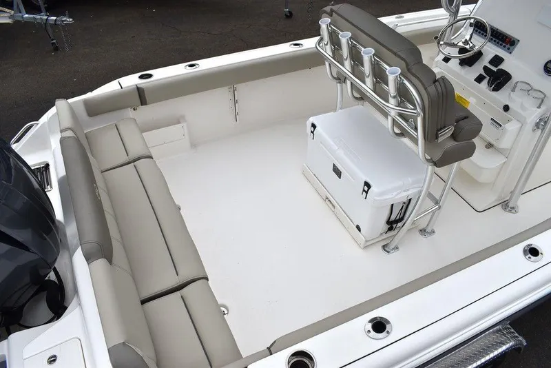 Slide: The Image of 2025 Key West 239 FS boat interior with seating and console. - 9