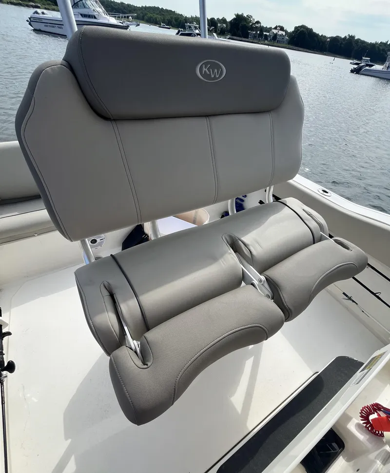 Slide: The Image of 2021 Key West 219 FS boat seat with gray upholstery. - 13