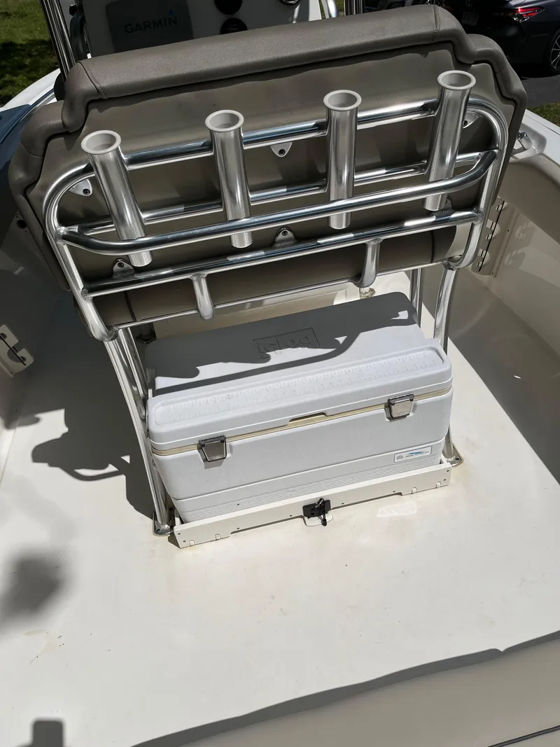 Slide: The Image of 2021 Key West 219 FS boat with rod holders and cooler storage. - 18