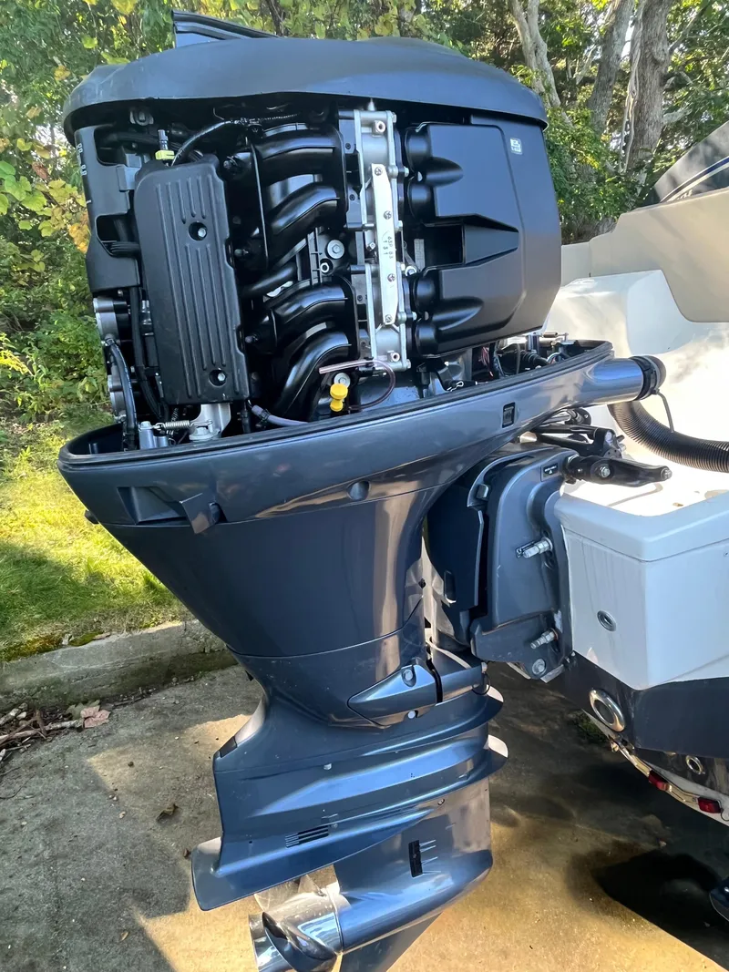 Slide: The Image of 2021 Key West 219 FS boat engine, detailed view of outboard motor components. - 20