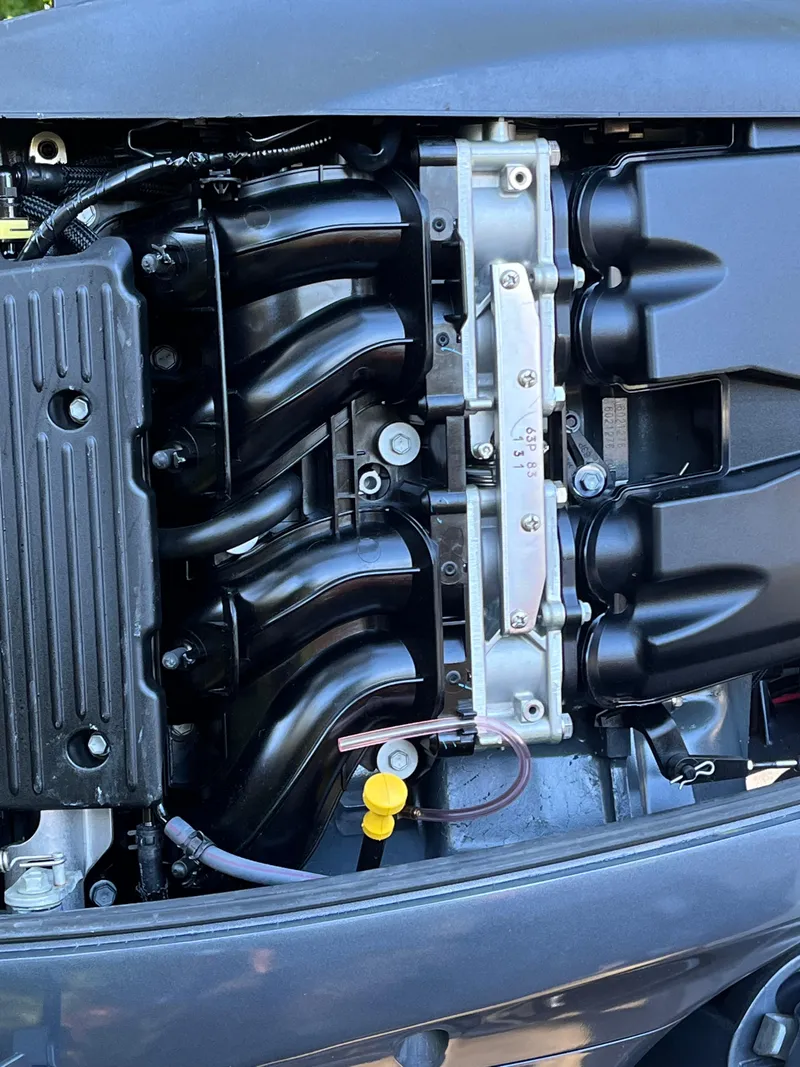 Slide: The Image of Close-up of a 2021 Key West 219 FS boat engine components. - 22