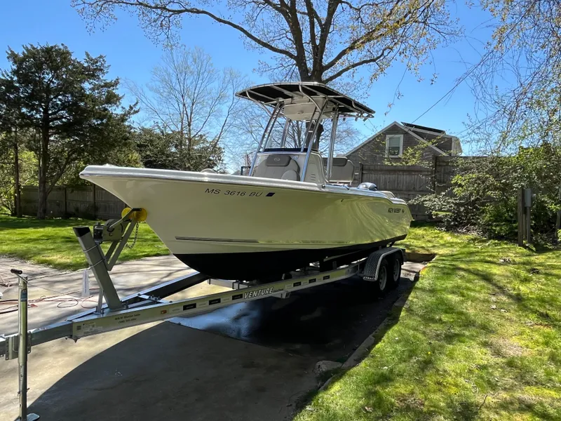 Slide: The Image of 2021 Key West 219 FS boat on trailer in sunny yard. - 6