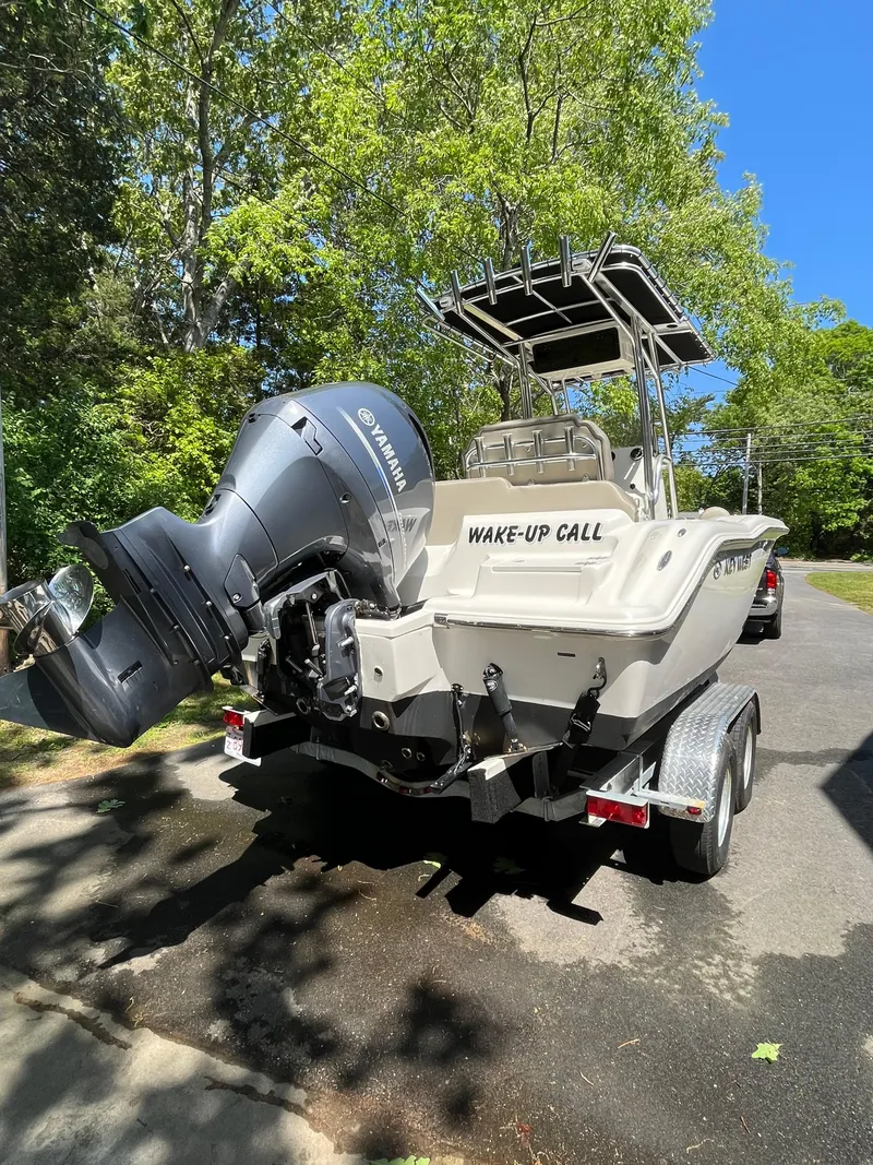 Slide: The Image of 2021 Key West 219 FS boat on trailer with Yamaha engine, labeled "Wake-Up Call." - 9