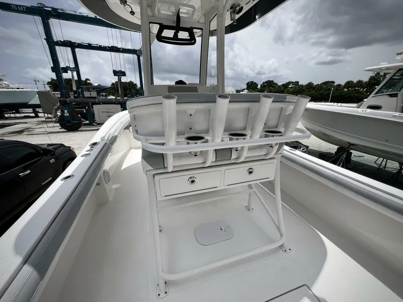 Slide: The Image of 2020 Regulator 23 boat interior with rod holders and storage drawers. - 12
