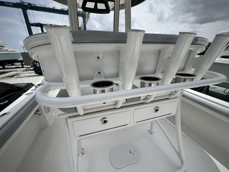 Slide: The Image of 2020 Regulator 23 boat interior with rod holders and storage compartments. - 13
