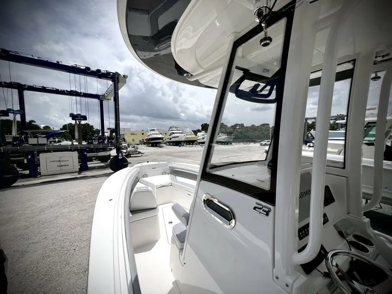 Slide: The Image of 2020 Regulator 23 boat at marina, showcasing sleek design and modern features. - 18