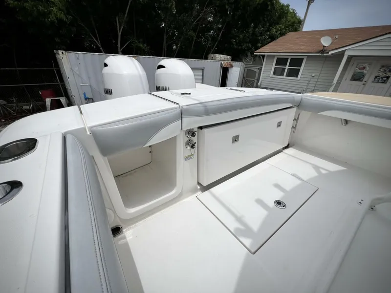 Slide: The Image of 2020 Regulator 23 boat interior with dual engines and storage compartments. - 29