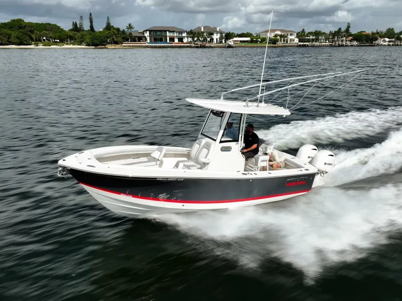 Slide: The Image of 2020 Regulator 23 boat cruising on a scenic waterway. - 3