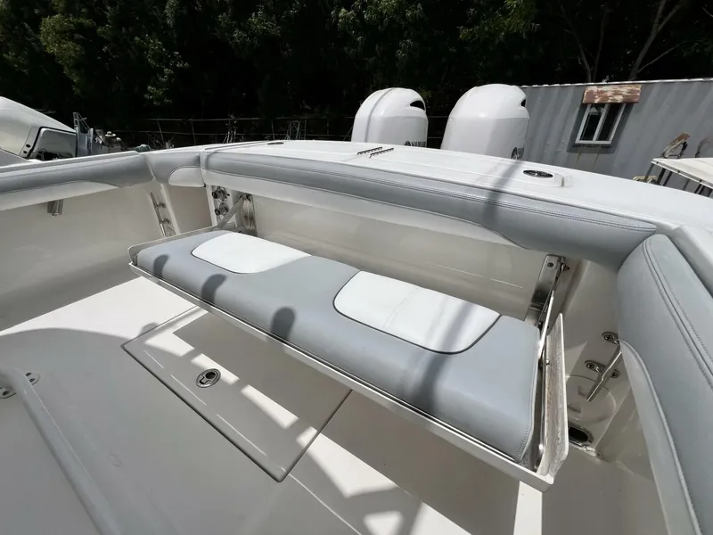 Slide: The Image of 2020 Regulator 23 boat with foldable seating and dual outboard motors. - 30