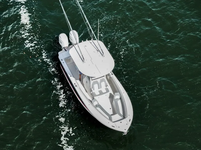 Slide: The Image of Aerial view of 2020 Regulator 23 boat cruising on open water. - 7