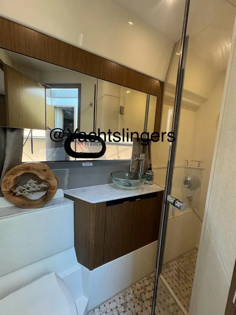 Slide: The Image of Luxurious bathroom in 2017 Sea Ray Sundancer yacht with modern fixtures and elegant design. - 12