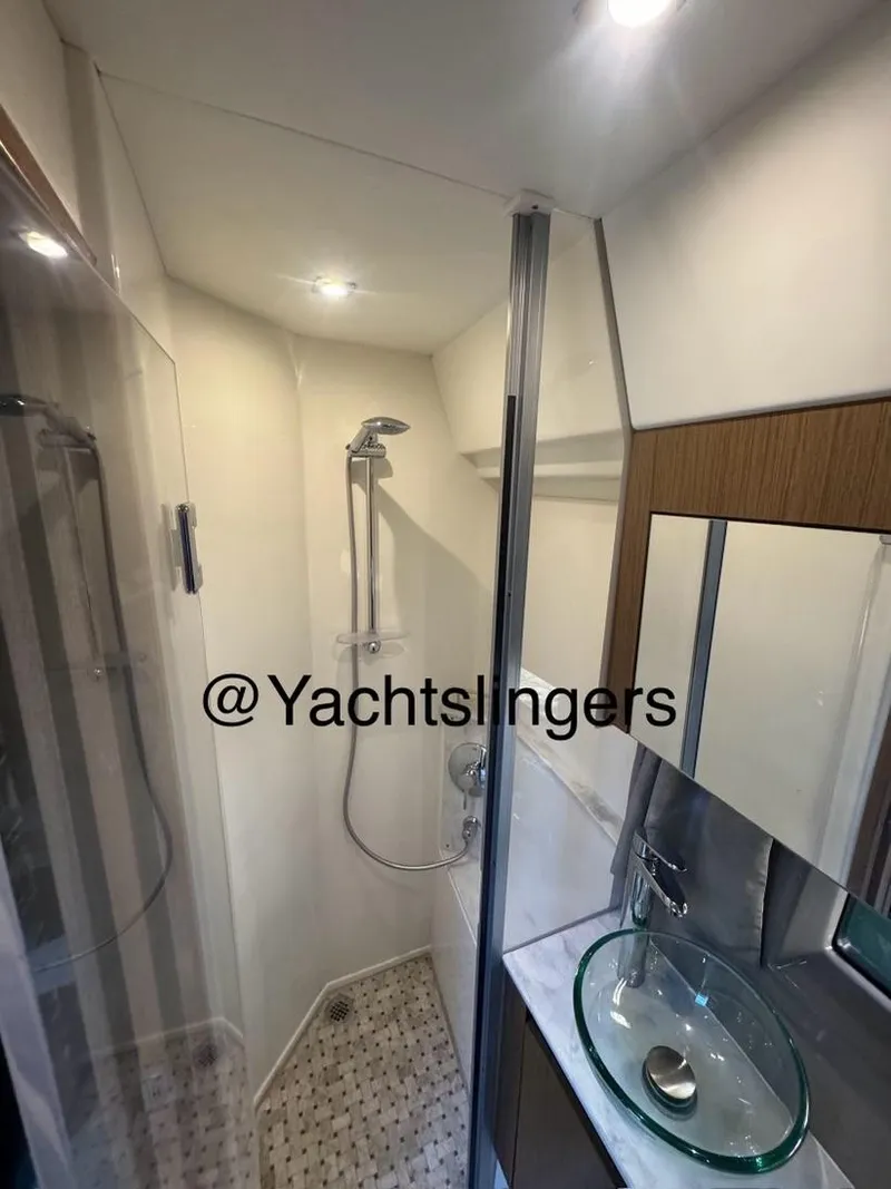Slide: The Image of 2017 Sea Ray Sundancer yacht bathroom with modern shower and glass sink. - 19