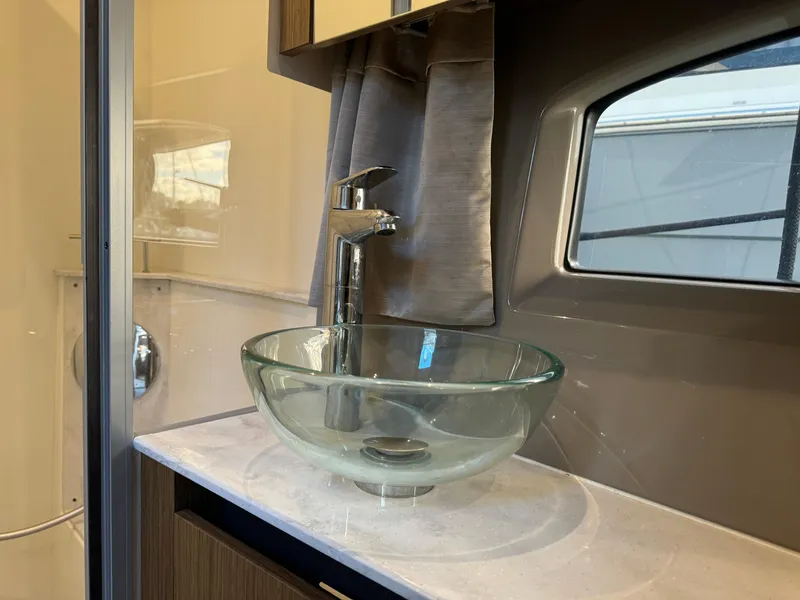 Slide: The Image of Modern glass sink in 2017 Sea Ray Sundancer yacht bathroom. - 20